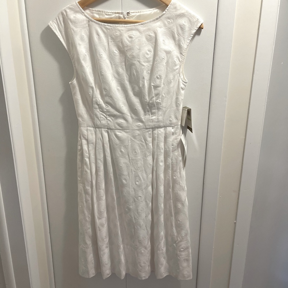 White Lord & Taylor dress. Swirled stitching throughout. Size 4.